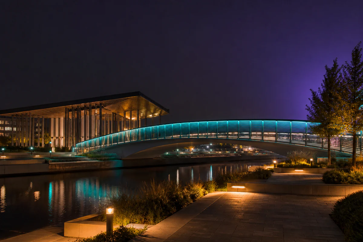 Pedestrian bridge illuminated with programmable architectural lighting